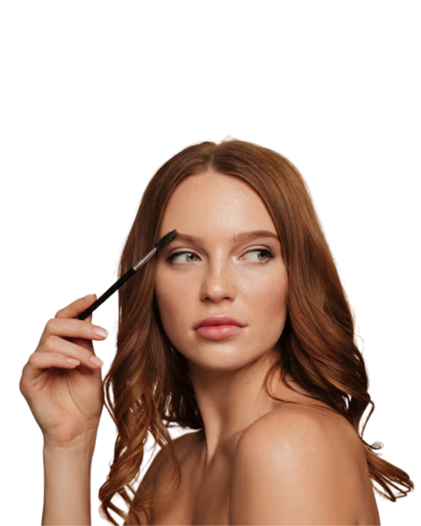 a girl brushing her eyebrows